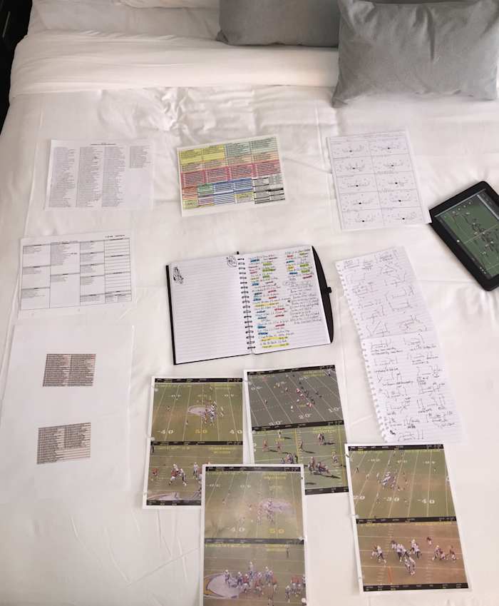 The day before the Browns game, Palmer has his study materials all set up in his Cleveland-area hotel room.